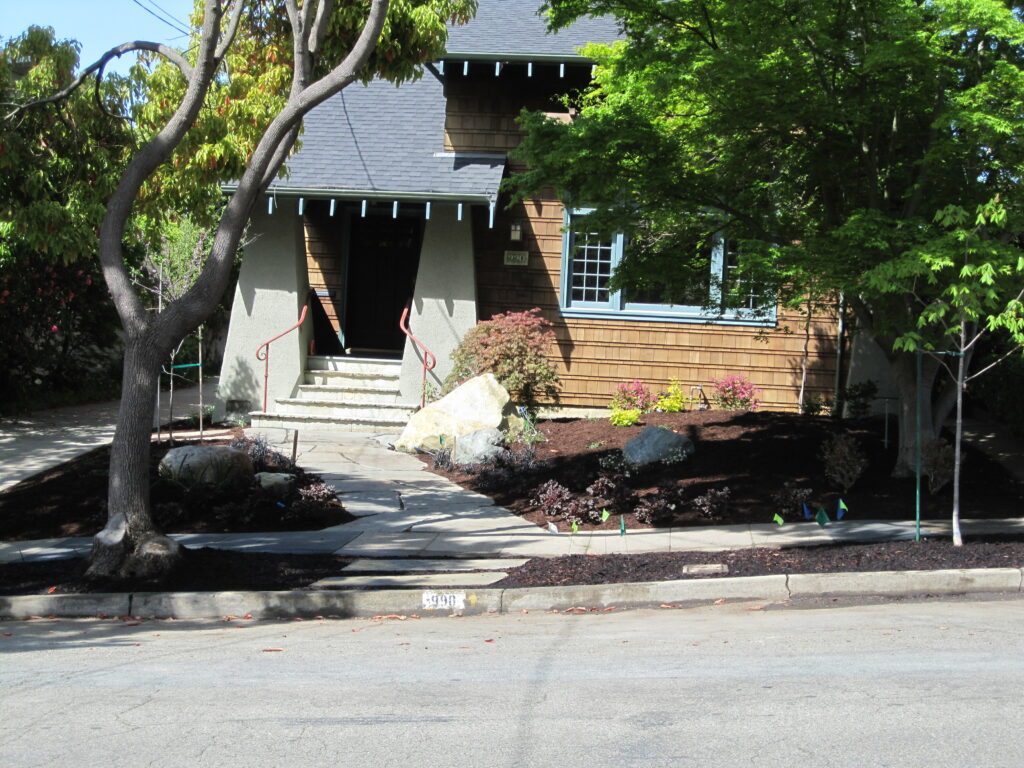 Single-family home with gabled roof and raised entry in Albany, featuring a landscaped front yard suited for curb appeal upgrades.