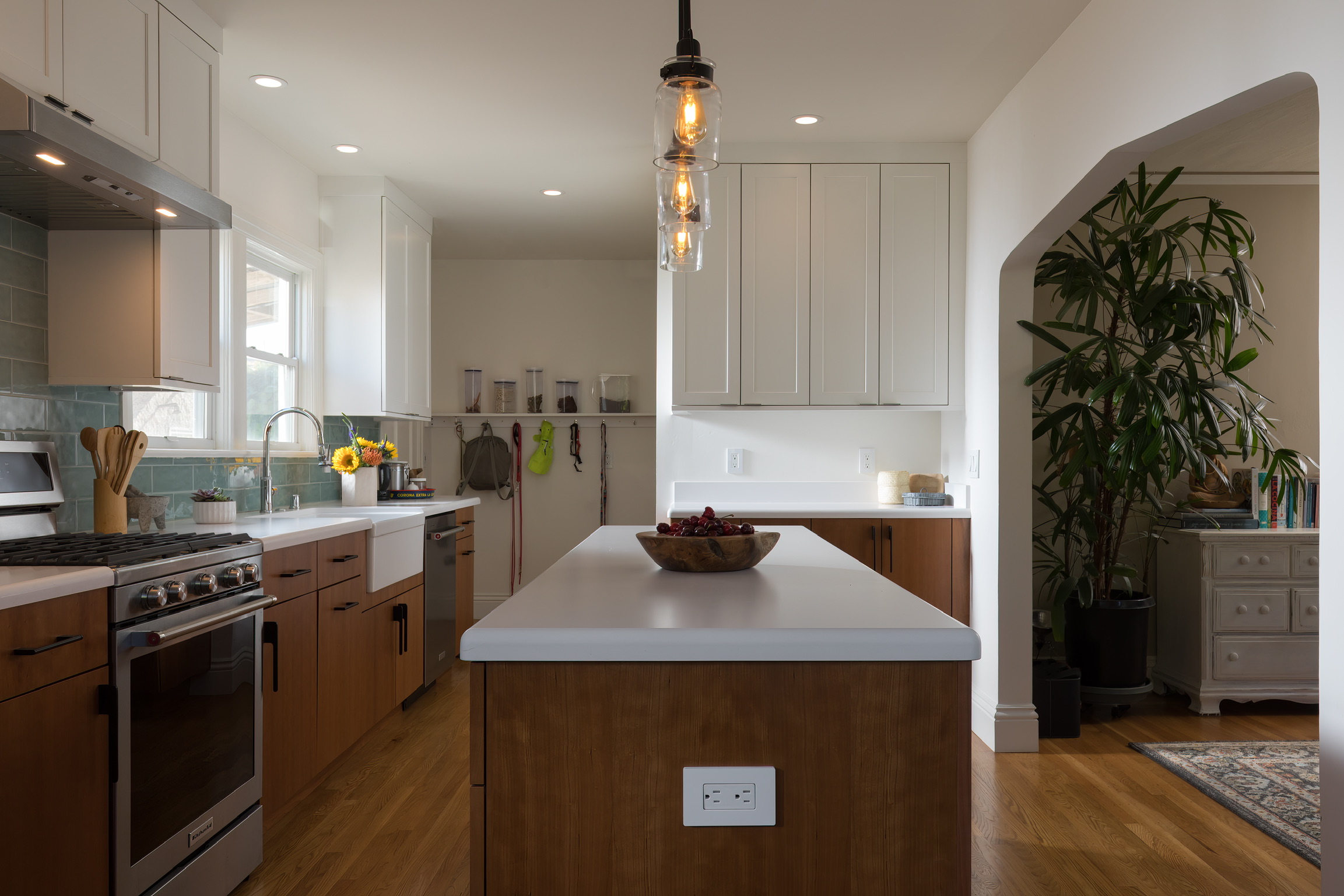 Berkeley kitchen with updated cabinetry, open layout, island workspace, modern appliances, and clear sightlines to adjacent room.