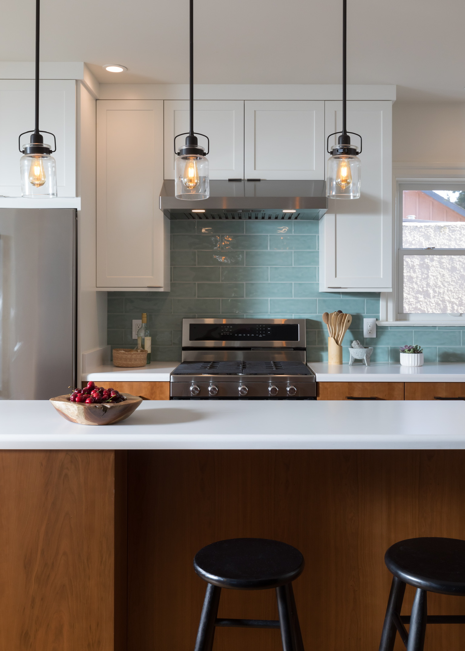 Modern Berkeley kitchen featuring an updated layout, quality built-in appliances, custom cabinetry, and modern lighting fixtures.