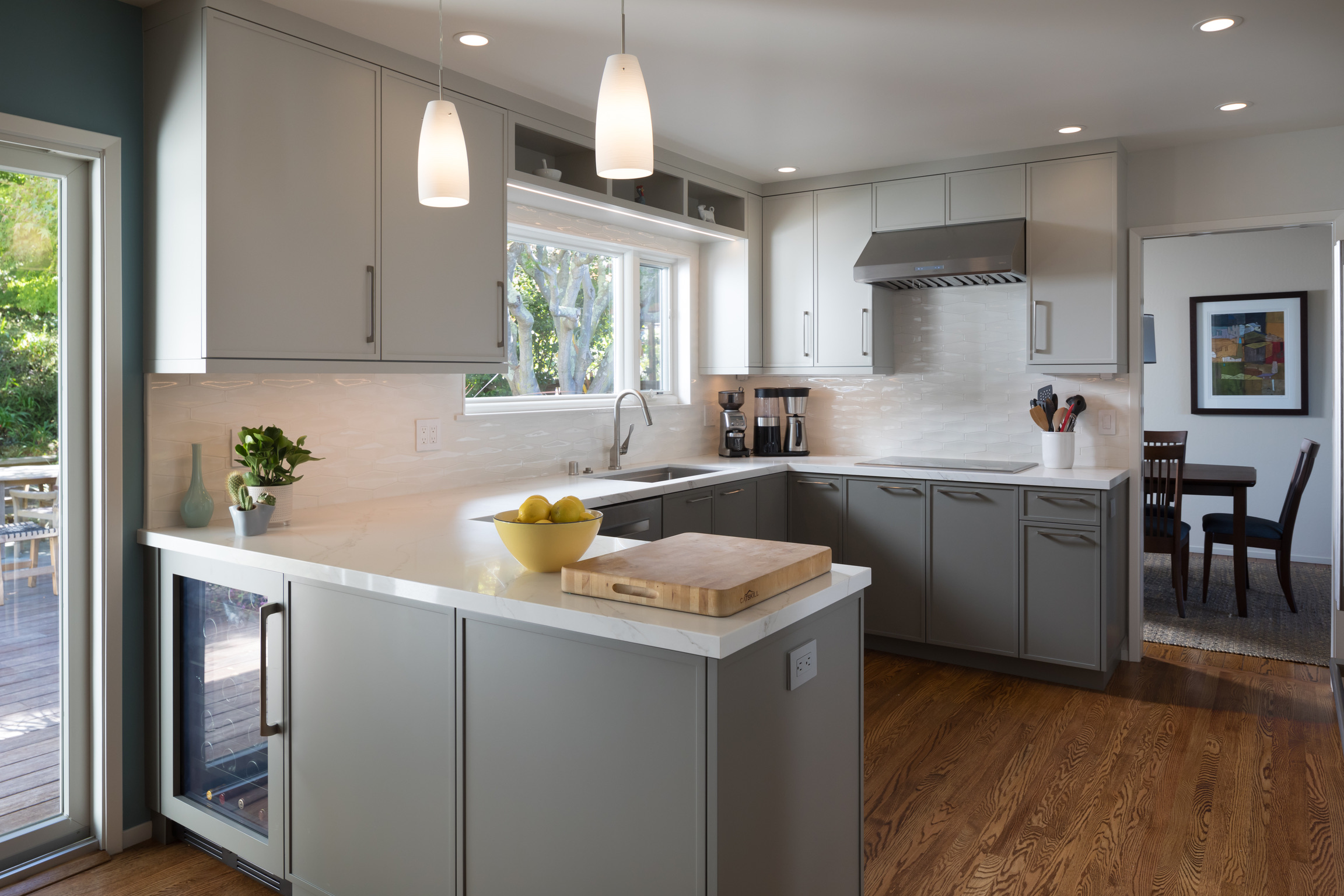 Modern El Cerrito kitchen with updated cabinetry, spacious countertops, island workspace, and open layout flowing into dining area.