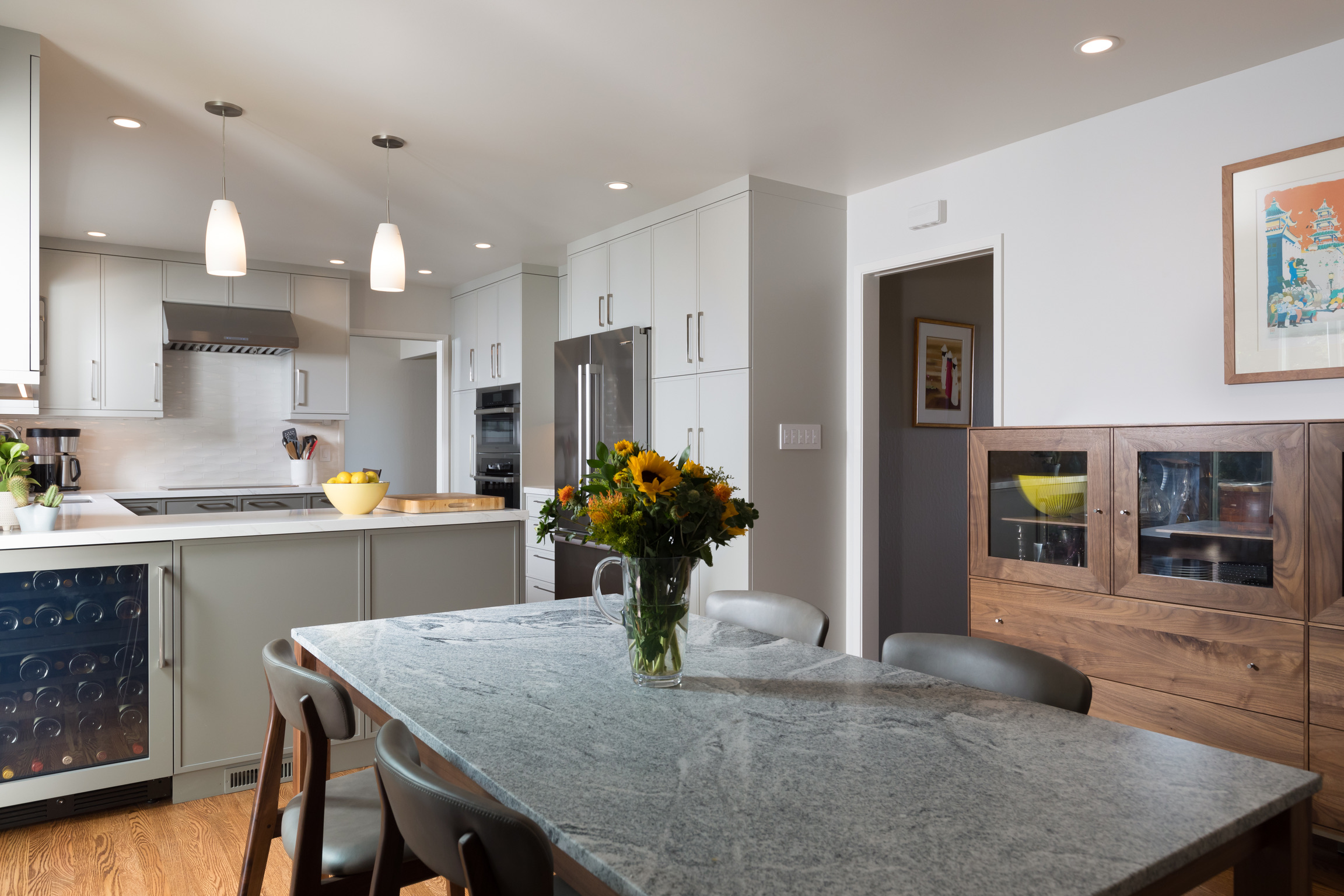 Modern kitchen in El Cerrito with updated cabinetry, quality appliances, open layout, and functional dining space for redevelopment potential.