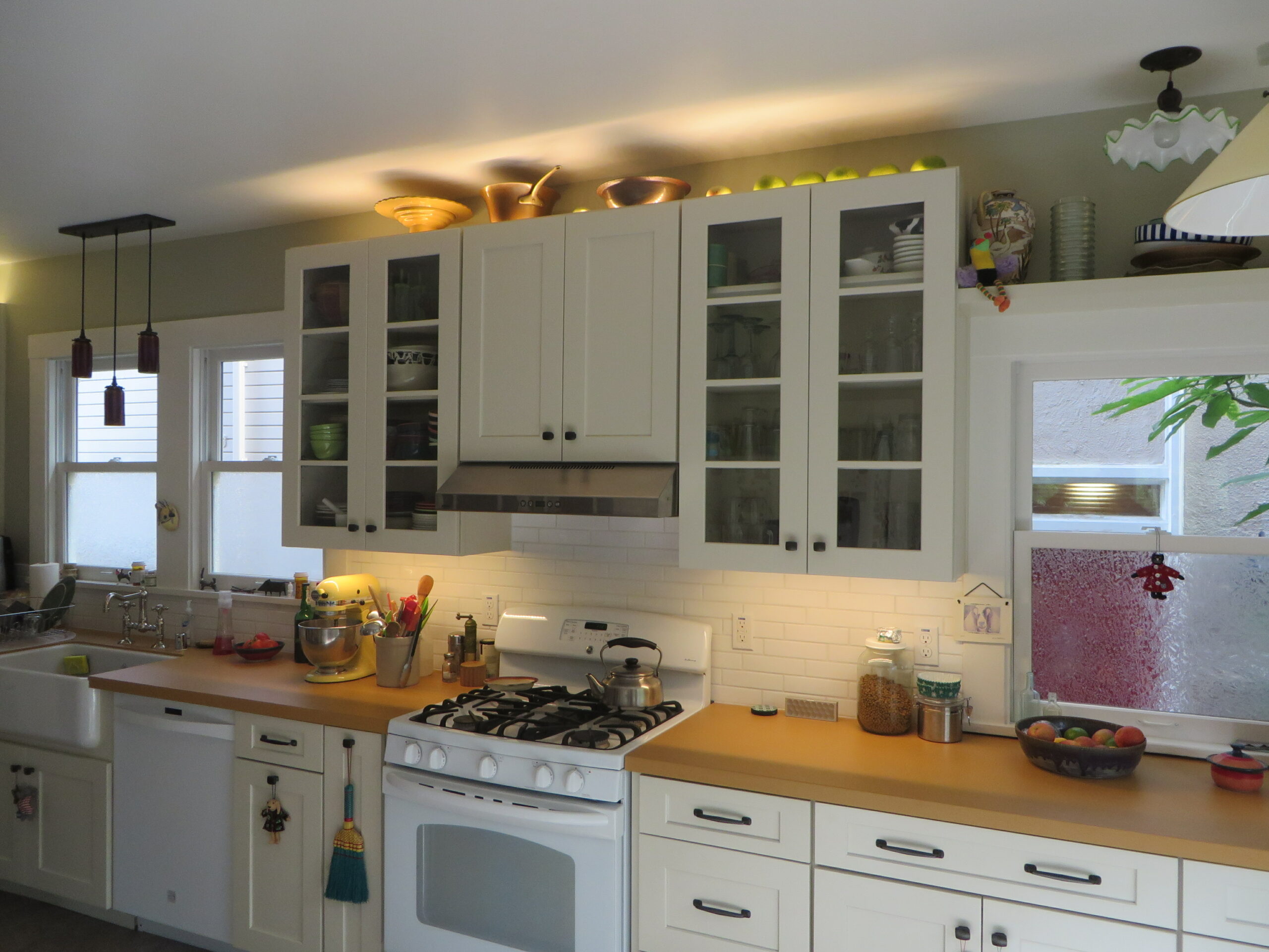 A renovated North Oakland kitchen featuring updated cabinetry, built-in storage, gas appliances, and efficient layout.