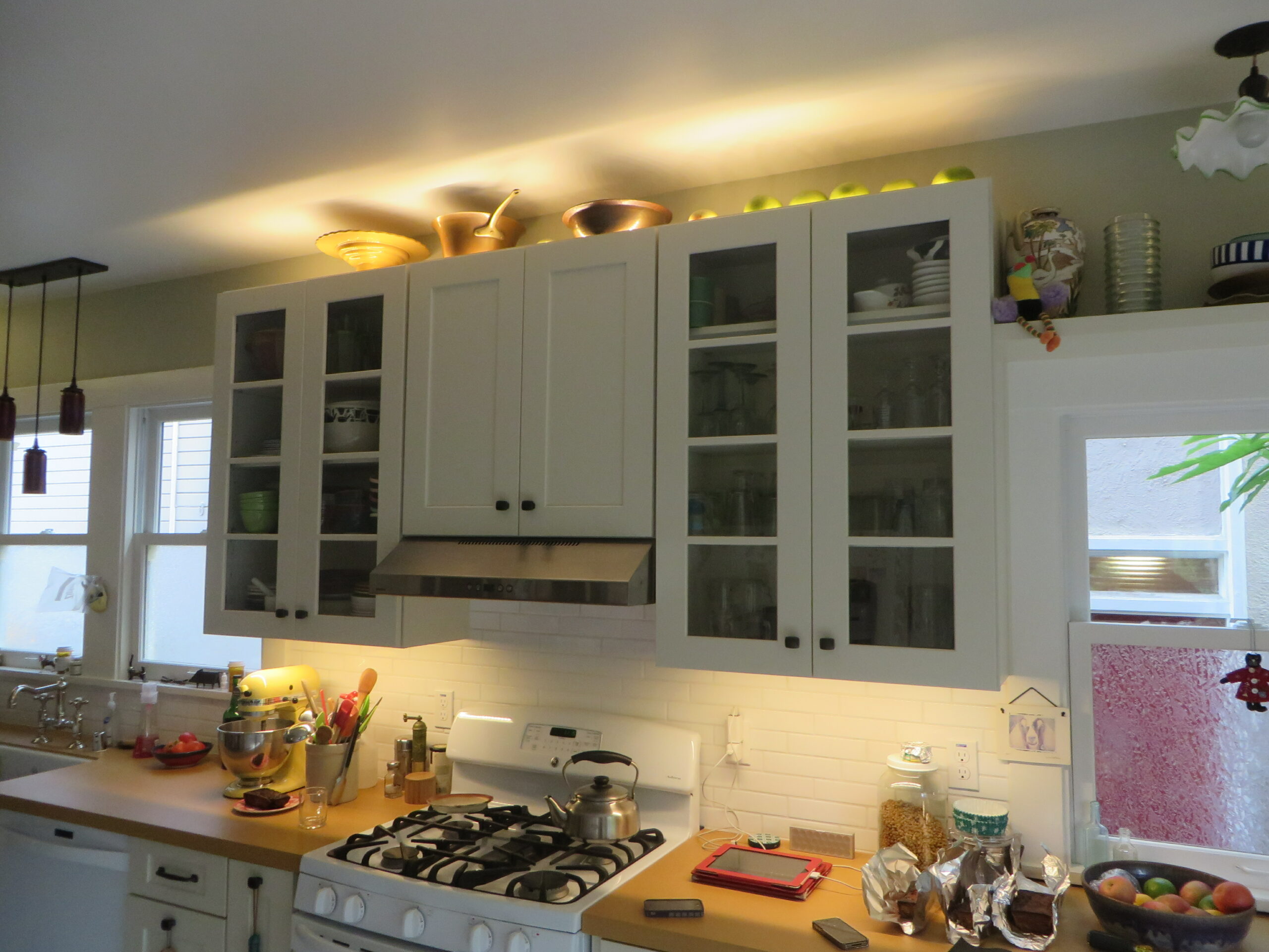 A North Oakland kitchen with ample cabinetry, gas stove, spacious counters, and potential for improved storage and layout optimization.