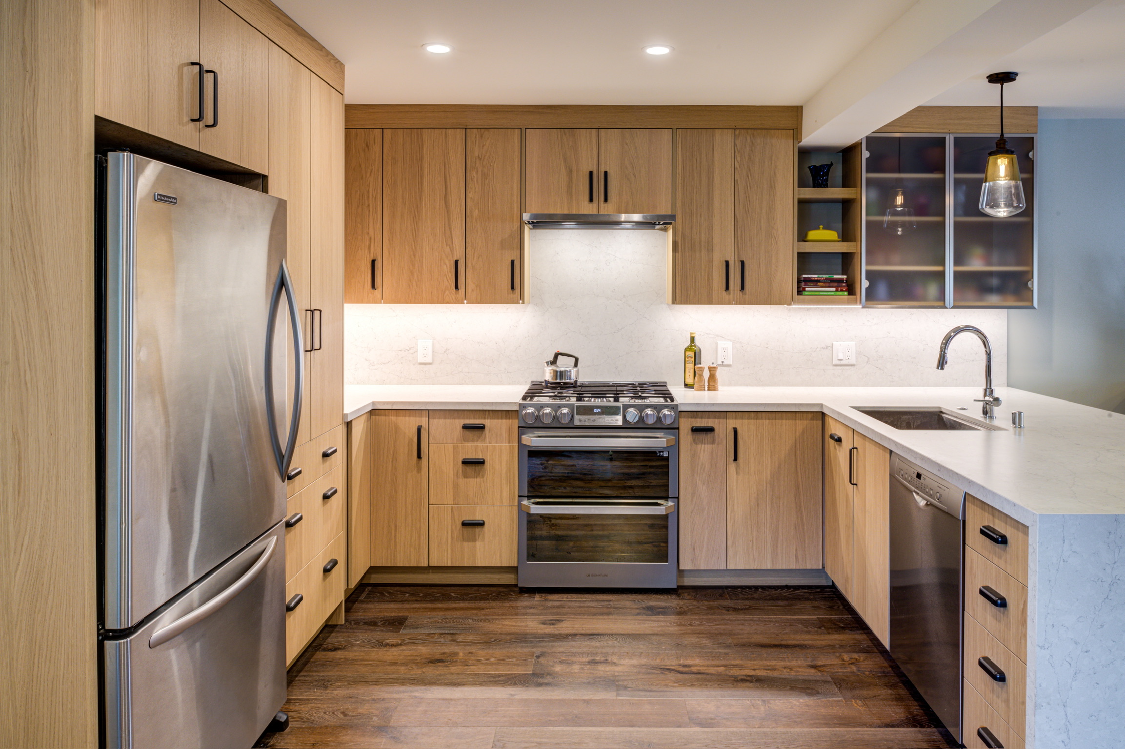Kitchen with updated cabinetry, high-end appliances, double oven, and functional layout—optimized for spacious entertaining.