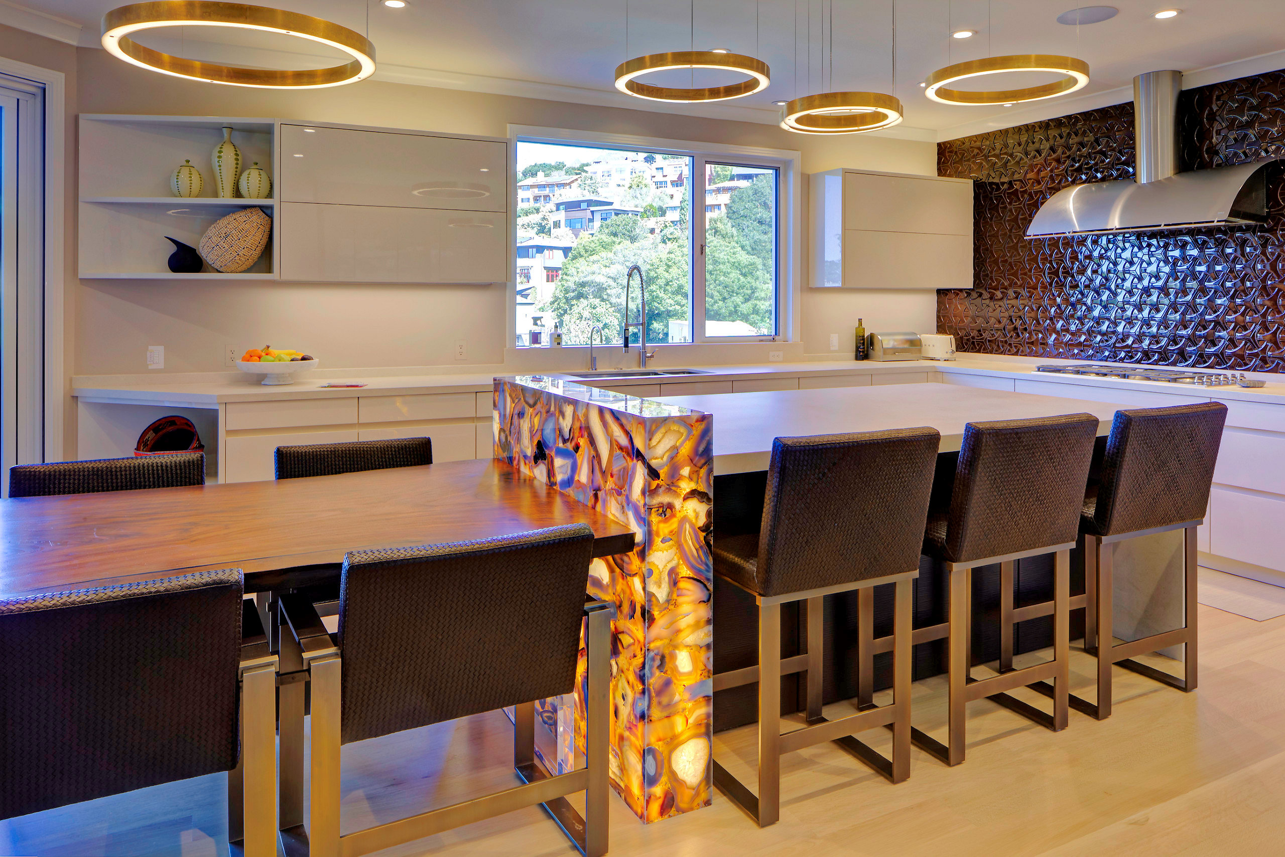 Modern Oakland Hills kitchen with a large illuminated island, upgraded lighting, and high-end cabinetry, ideal for redevelopment.