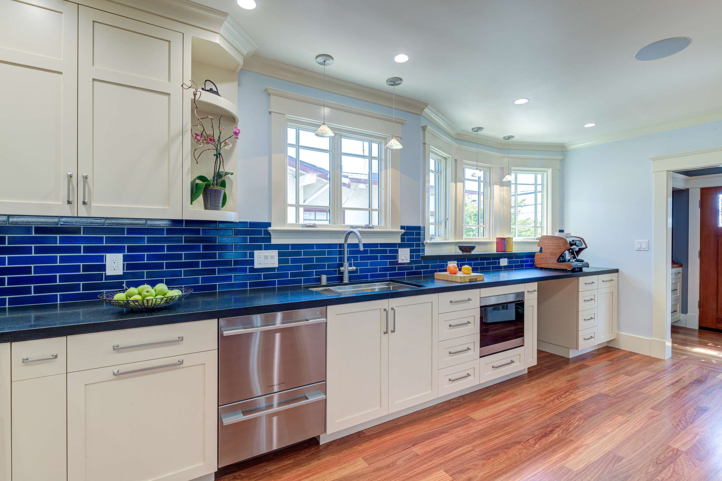 Contemporary Oakland kitchen featuring updated cabinetry, modern appliances, durable countertops, and upgraded flooring.
