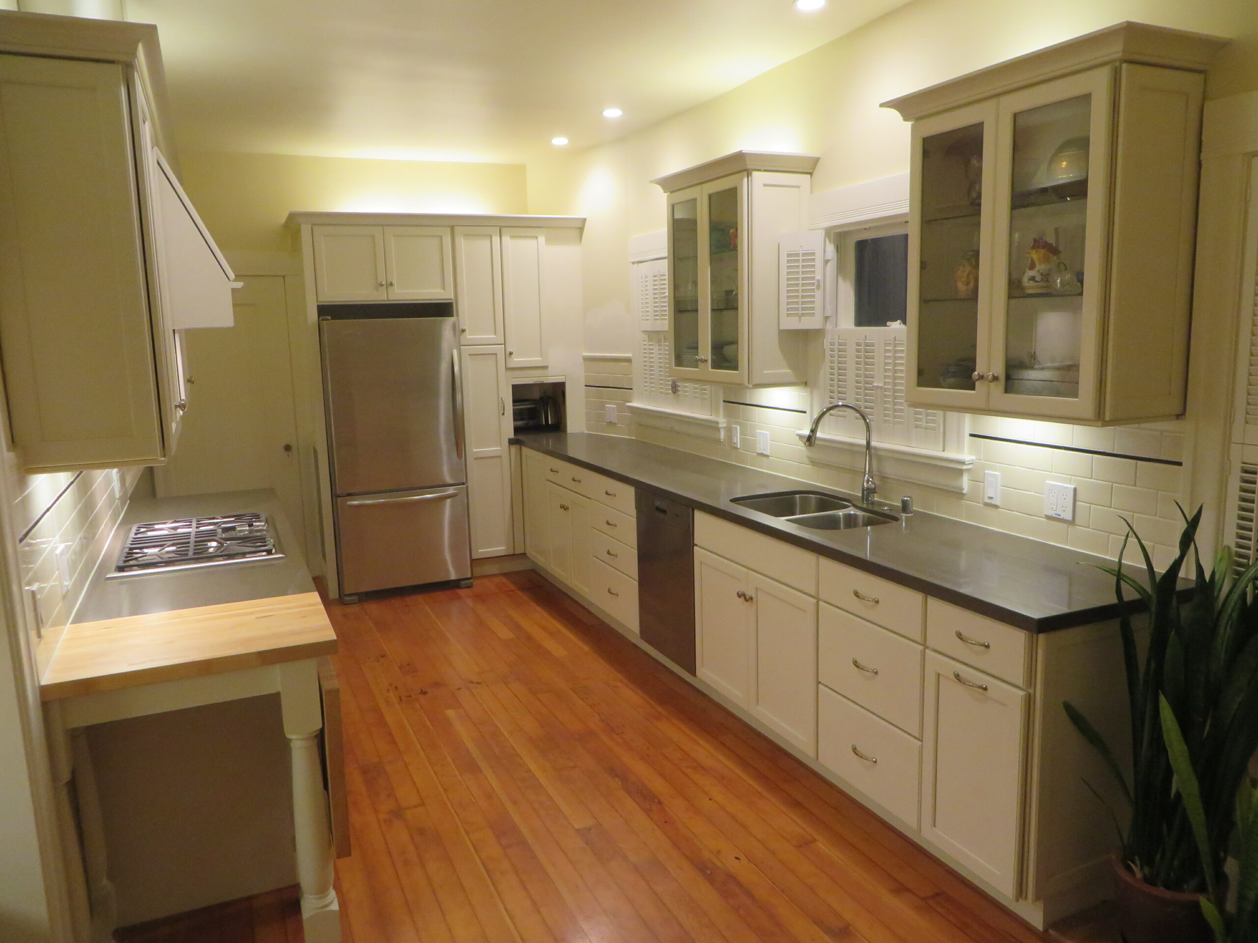 Modern Piedmont kitchen featuring updated cabinetry, high-end appliances, durable countertops, and hardwood flooring throughout.