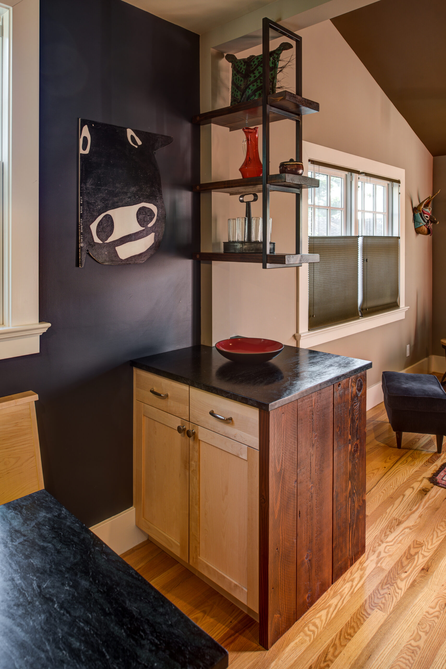 A compact kitchen remodel showcases efficient use of space with built-in storage, durable surfaces, and maximized shelving.