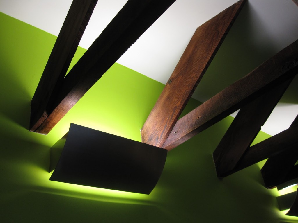 Exposed wooden ceiling beams and updated lighting show structural appeal and modern upgrades suitable for redevelopment projects.