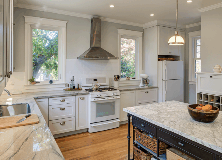 Kitchen features updated layout, high-end appliances, and preserved architectural elements, blending historic value with efficiency.