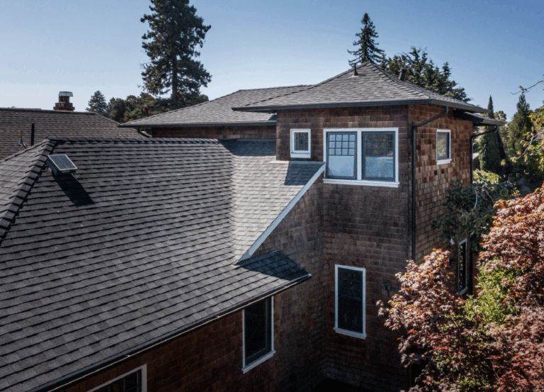 A multi-story house with updated windows demonstrates a high-quality historical renovation, featuring enhanced structural integrity.