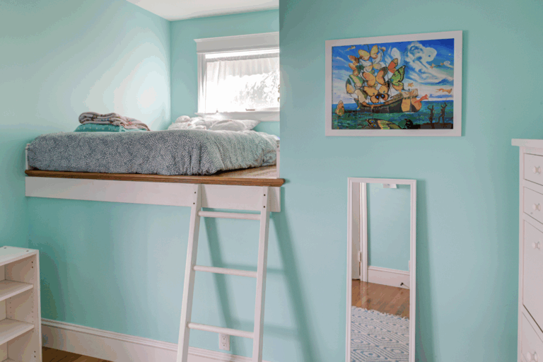 Room features maximized vertical space with a loft bed, efficient layout, and preserved architectural elements suited for redevelopment.