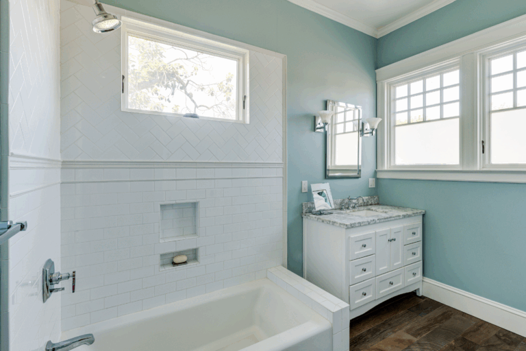 Bathroom featuring original window placement, modernized fixtures, high-quality finishes, and updated plumbing—ideal for redevelopment.
