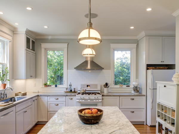 Renovated kitchen emphasizing open layout, upgraded fixtures, energy-efficient windows, and high-quality surfaces for added value.